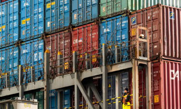 Crews offload the SM Ningbo at the Port of Portland on October 20