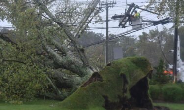 Crews are working to restore power to hundreds of thousands in New England. An uprooted large tree brought down power lines in Sandwich