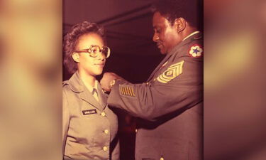 Gwen Bingham receiving her Second Lieutenant bars at the University of Alabama's ROTC commissioning ceremony in 1981.