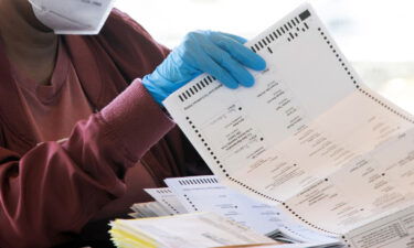 An election worker counts Fulton County ballots on November 4