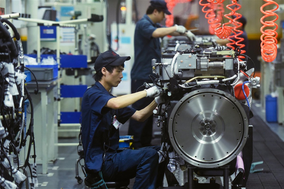 <i>Chinatopix/AP</i><br/>An unfolding crisis in real estate is emerging as one of Beijing's toughest challenges. Workers are shown here assembling truck engines at a subsidiary factory of the China National Heavy Duty Truck Group in Hangzhou in east China's Zhejiang province