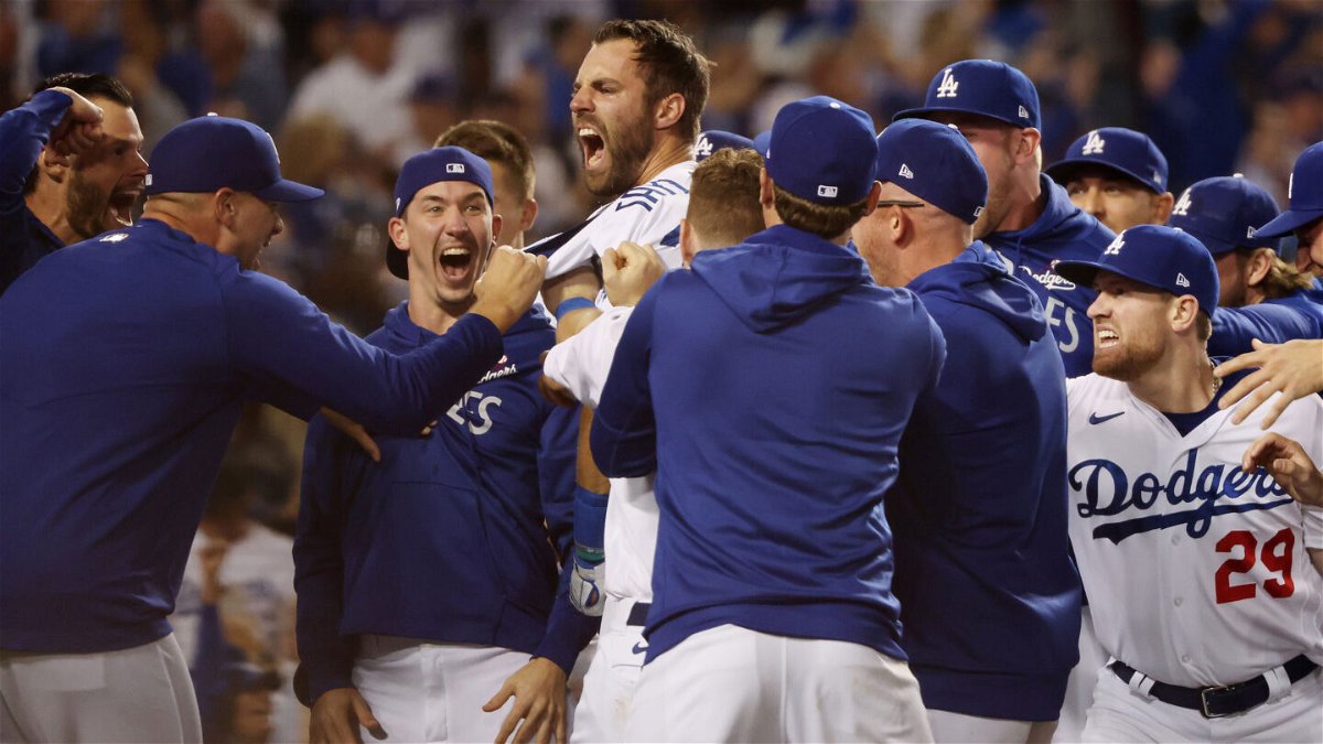 <i>Harry How/Getty Images</i><br/>Chris Taylor of the Los Angeles Dodgers celebrates with teammates after his walk-off home run in the ninth inning to defeat the St. Louis Cardinals on Wednesday at Dodger Stadium in Los Angeles.
