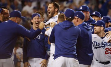 Chris Taylor of the Los Angeles Dodgers celebrates with teammates after his walk-off home run in the ninth inning to defeat the St. Louis Cardinals on Wednesday at Dodger Stadium in Los Angeles.