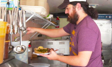 Alex Barbosa preps a plate of barbecue in his mobile barbecue trailer Barbosa's Barbeque.