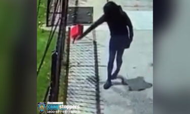 Surveillance video shows a woman pouring gasoline outside of Yashiva of Flatbush on October 14