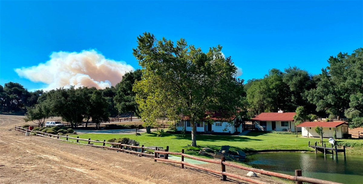 <i>Mike Eliason/Santa Barbara County Fire/AP</i><br/>A smoke column builds in the distance behind Rancho del Cielo in Santa Barbara County.