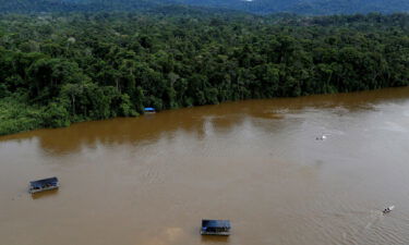 The drowning of two young boys in a river in the Brazilian state of Roraima has local community leaders asking if illegal mining played a role. A gold dredge is seen at the banks of Uraricoera River in the heart of the Amazon rainforest