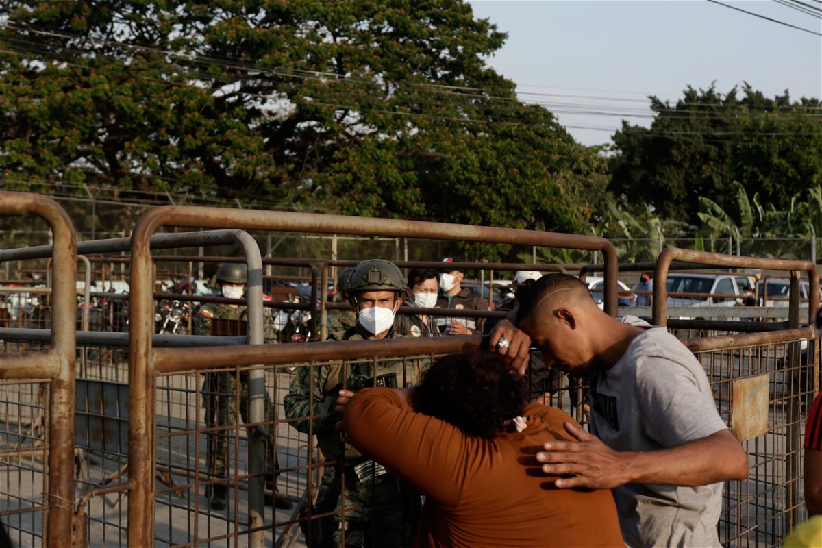 <i>Angel DeJesus/AP</i><br/>Relatives of prisoners await news outside the Litoral penitentiary in Guayaquil on Sept. 29.