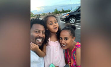 Dagne and Rahel Estifanos pose with their daughter
