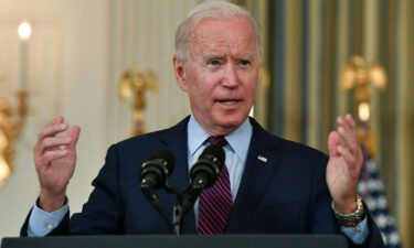 US President Joe Biden gestures as he delivers remarks on the debt ceiling from the State Dining Room of the White House on October 4