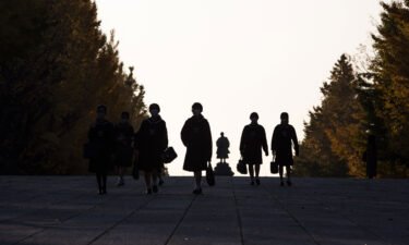 Suicides among Japanese schoolchildren hit a record high during the last school year. Japanese elementary school students are shown here walking home after their lessons.