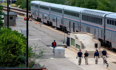 The deadly shooting on an Amtrak train in Arizona on Monday erupted after US Drug Enforcement Administration agents recovered large amounts of marijuana on board. Investigators are shown here on the scene of the deadly shooting in Tuscon