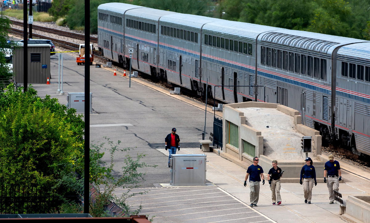 <i>Rebecca Sasnett/Arizona Daily Star/AP</i><br/>The deadly shooting on an Amtrak train in Arizona on Monday erupted after US Drug Enforcement Administration agents recovered large amounts of marijuana on board. Investigators are shown here on the scene of the deadly shooting in Tuscon