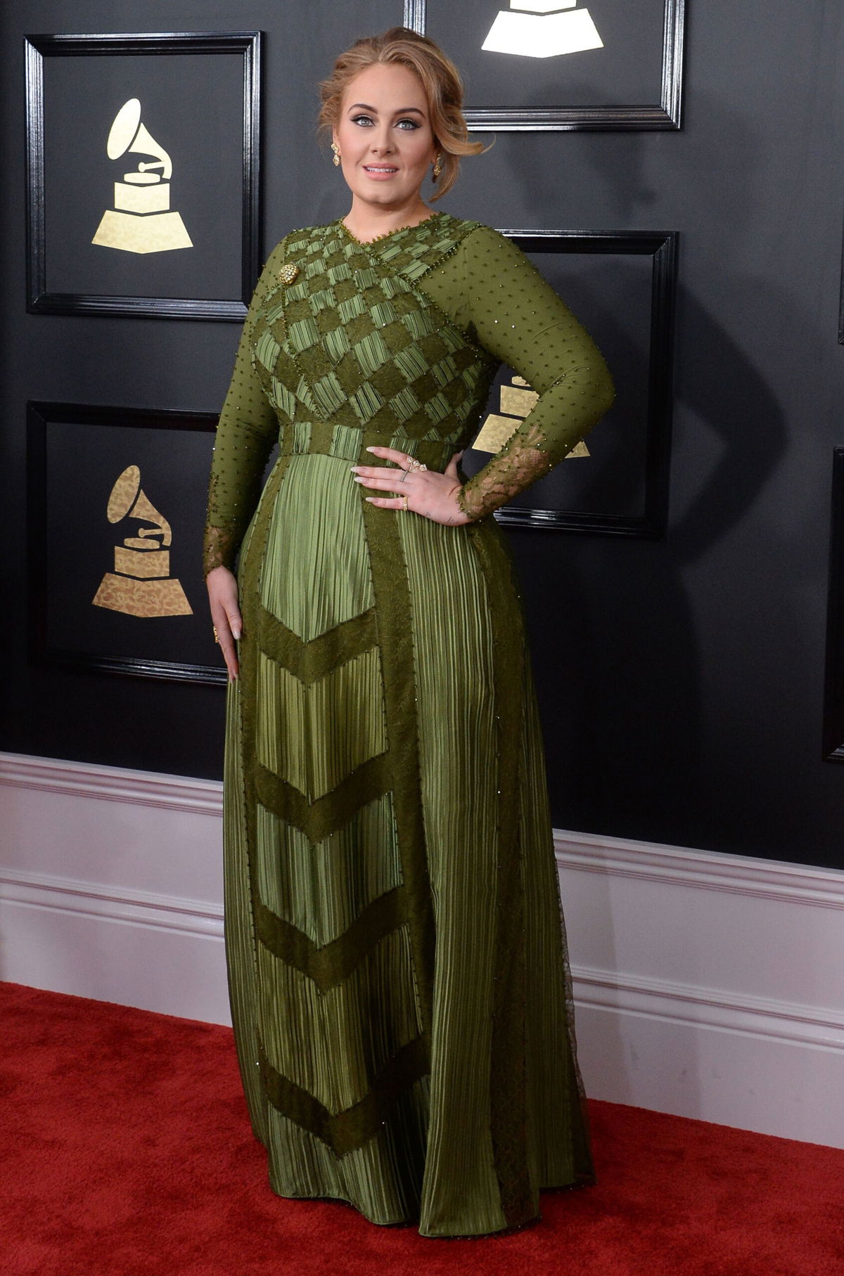 <i>Jim Ruymen/UPI/Shutterstock</i><br/>Adele is opening up about making her upcoming album and finding happiness. The singer is shown here at the 59th annual Grammy Awards held at Staples Center in Los Angeles on February 12