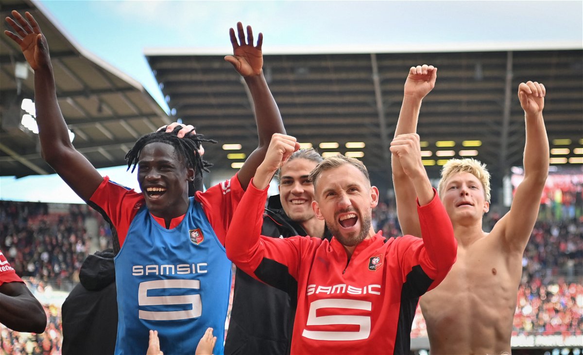 <i>LOIC VENANCE/AFP/AFP via Getty Images</i><br/>Rennes' players celebrate a famous win against PSG.