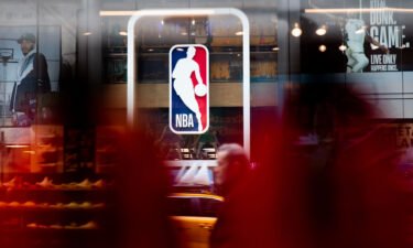 Eighteen former NBA players have been indicted on charges that they allegedly defrauded a health care plan of millions of dollars that served current and former players. An NBA logo is shown here at the 5th Avenue NBA store on March 12