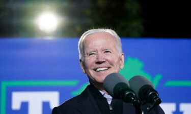 Democrats are still struggling to secure an agreement on President Joe Biden's economic agenda. Biden is seen here October 26 Arlington