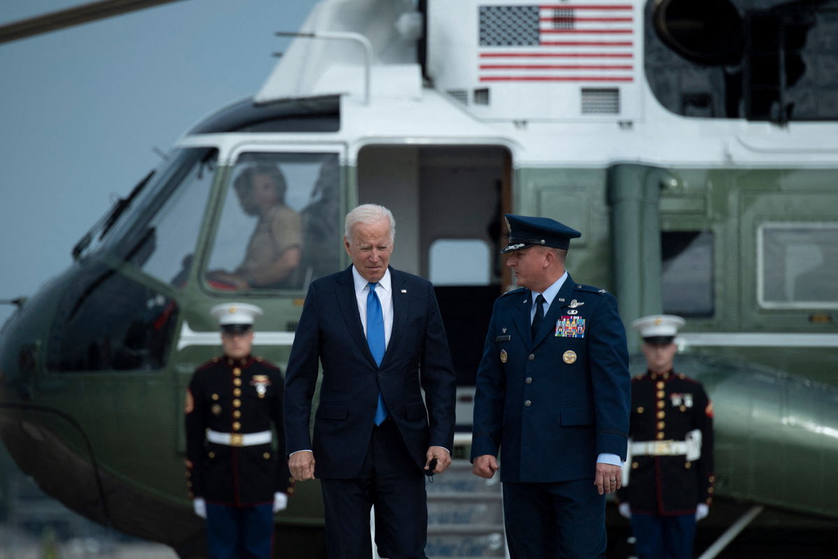 <i>BRENDAN SMIALOWSKI/AFP/Getty Images</i><br/>President Joe Biden on Thursday is expected to face questions about his legislative agenda and his handling of key issues during his first year in office when he participates in a CNN town hall in Baltimore. Biden is seen here at Joint Base Andrews in Maryland on October 15