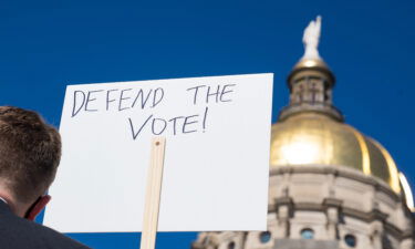 Demonstrators stand outside of the Capitol building in opposition of House Bill 531 on March 8