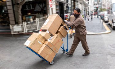 UPS just posted its best year ever. A UPS driver delivers packages in San Francisco in July.