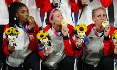 Labbe kisses her Olympic gold medal
