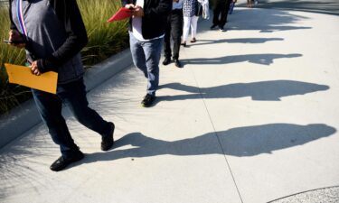 Labor shortages are now a hallmark of the recovering pandemic economy. People are shown here lining up to attend a job fair for employment  at SoFi Stadium on September 9