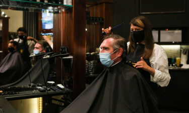 NSW Premier Dominic Perrottet receives a haircut on October 11