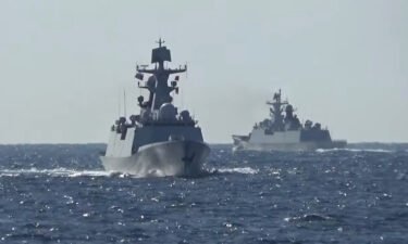A group of naval vessels from Russia and China conduct a joint maritime military patrol in the waters of the Pacific Ocean