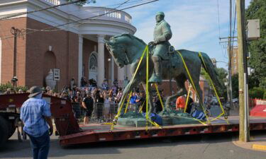 A statue of Confederate general Robert E. Lee located in Charlottesvilles being transported away on East Jefferson street after being removed from Market Street Park in Charlottesville