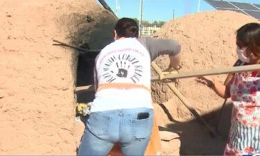 People learn traditional Native American cooking techniques at The Indian Pueblo Cultural Center in Albuquerque