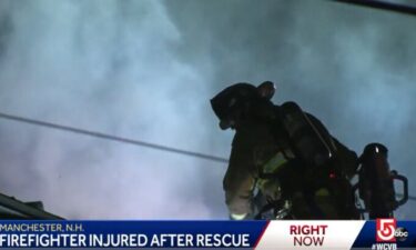 A firefighter battles a blaze at a deadly Manchester