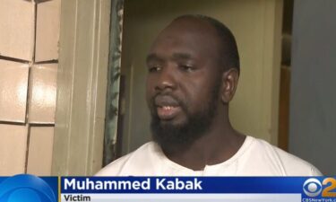 Muhammed Kabak stands outside his apartment at the Mitchel Houses in the Bronx