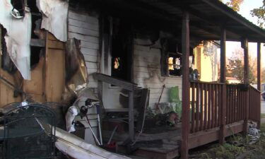 An arson investigation is underway after a fire left a woman who neighbors affectionately called Grandma Sue
