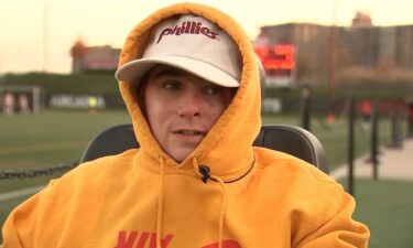 Austin cheered on his sister from the sideline of her playoff game. He was badly burned in an accident in May.