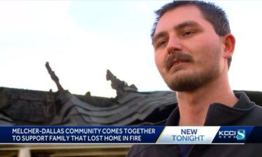 Dustin Bach stands in front of his home in Melcher-Dallas