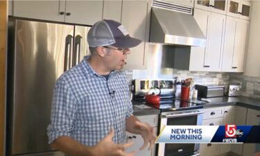 Eric Peterson stands in the kitchen of his North Andover