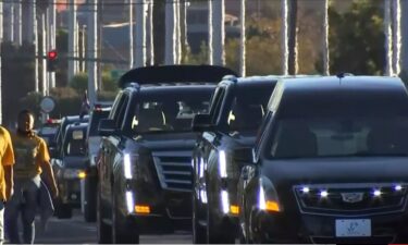 Marchers walk and a procession of hearses slowly drive in Las Vegas on November 14 during a Stop the Violence demonstration organized by the  Funeral Directors and Morticians Association of Nevada.