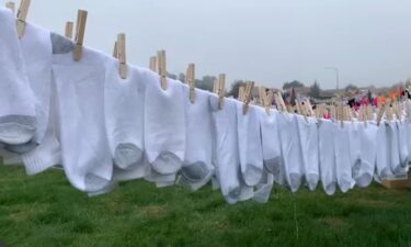 Socks hang on a line in Fresno