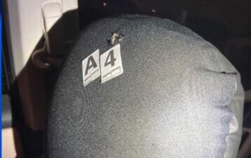 One of the bullets hit the back of driver's headrest. No one was injured.