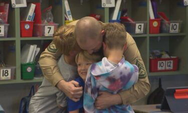 The U.S. Marine has been away from his family for 317 days during his fourth deployment. He surprised his sons at school when he returned home this week.