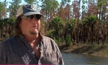 John McMillan stands near a canal in the Picayune Strand State Forest in Collier County