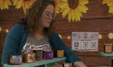 Ashleigh Ringle with the soy-based candles she makes at home. Ringle