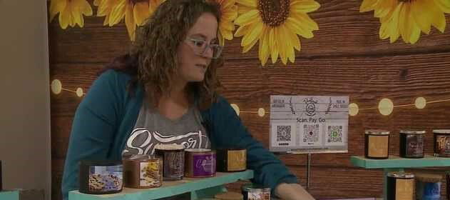 <i>KETV</i><br/>Ashleigh Ringle with the soy-based candles she makes at home. Ringle