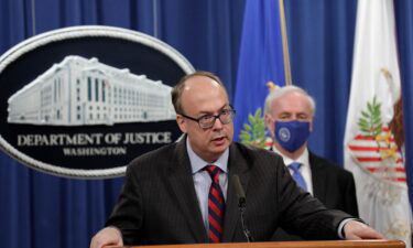 Acting Assistant U.S. Attorney General Jeffrey Clark speaks next to Deputy U.S. Attorney General Jeffrey Rosen at a news conference at the Justice Department on October 21