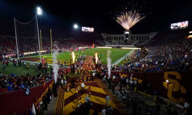 University of Southern California football players enter the field before an NCAA college football game against BYU in Los Angeles