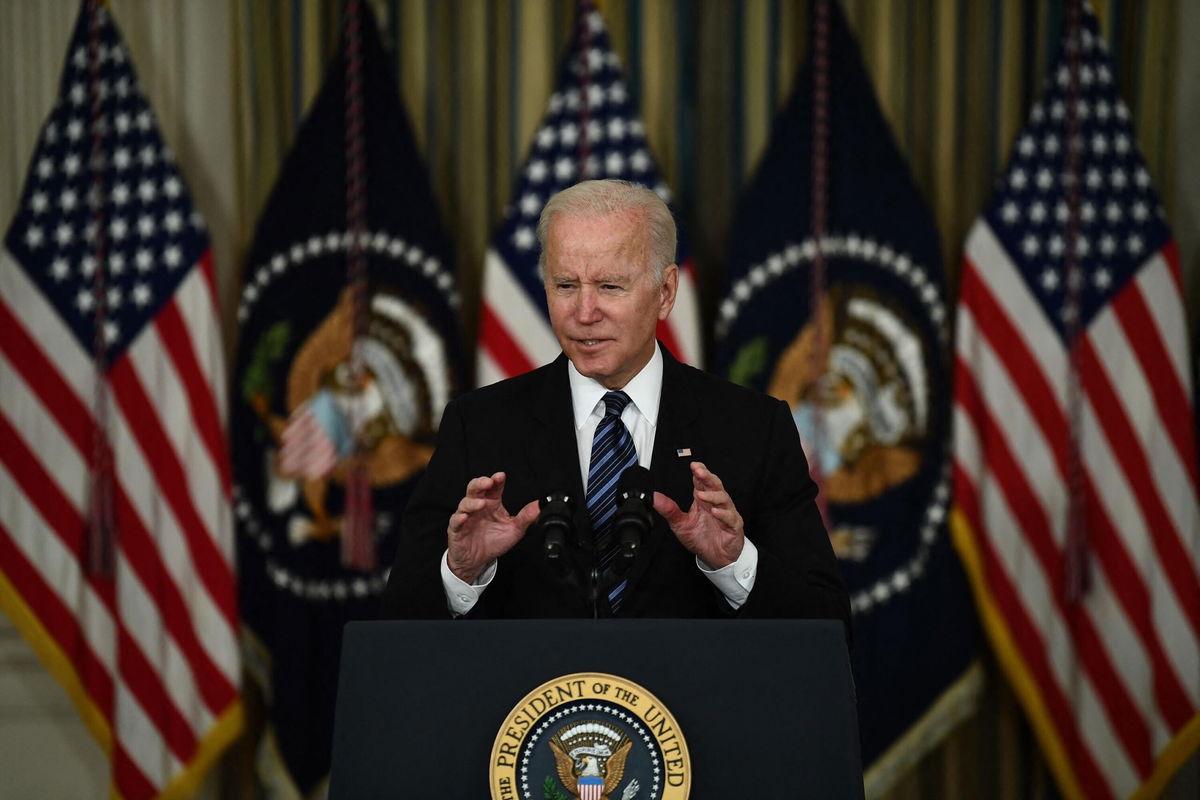 <i>BRENDAN SMIALOWSKI/AFP/Getty Images</i><br/>US President Joe Biden delivers remarks on the October jobs report from the State Dining Room of the White House in Washington