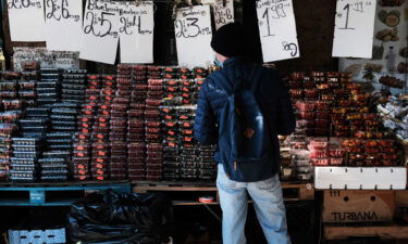 People shop at an outdoor food market in Manhattan on November 05