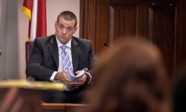 Glynn County police Officer Jeff Brandeberry sits on the witness stand Tuesday in Brunswick