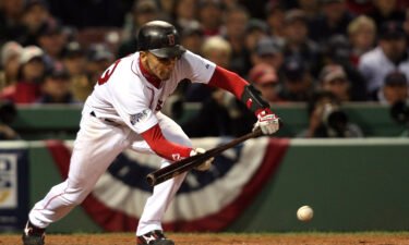 Julio Lugo lays down a bunt against the Colorado Rockies during Game Two of the 2007 World Series at Fenway Park on October 25