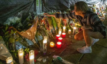 Hannah Longoria attends a makeshift memorial for those who died at the Astroworld Festival in Houston.